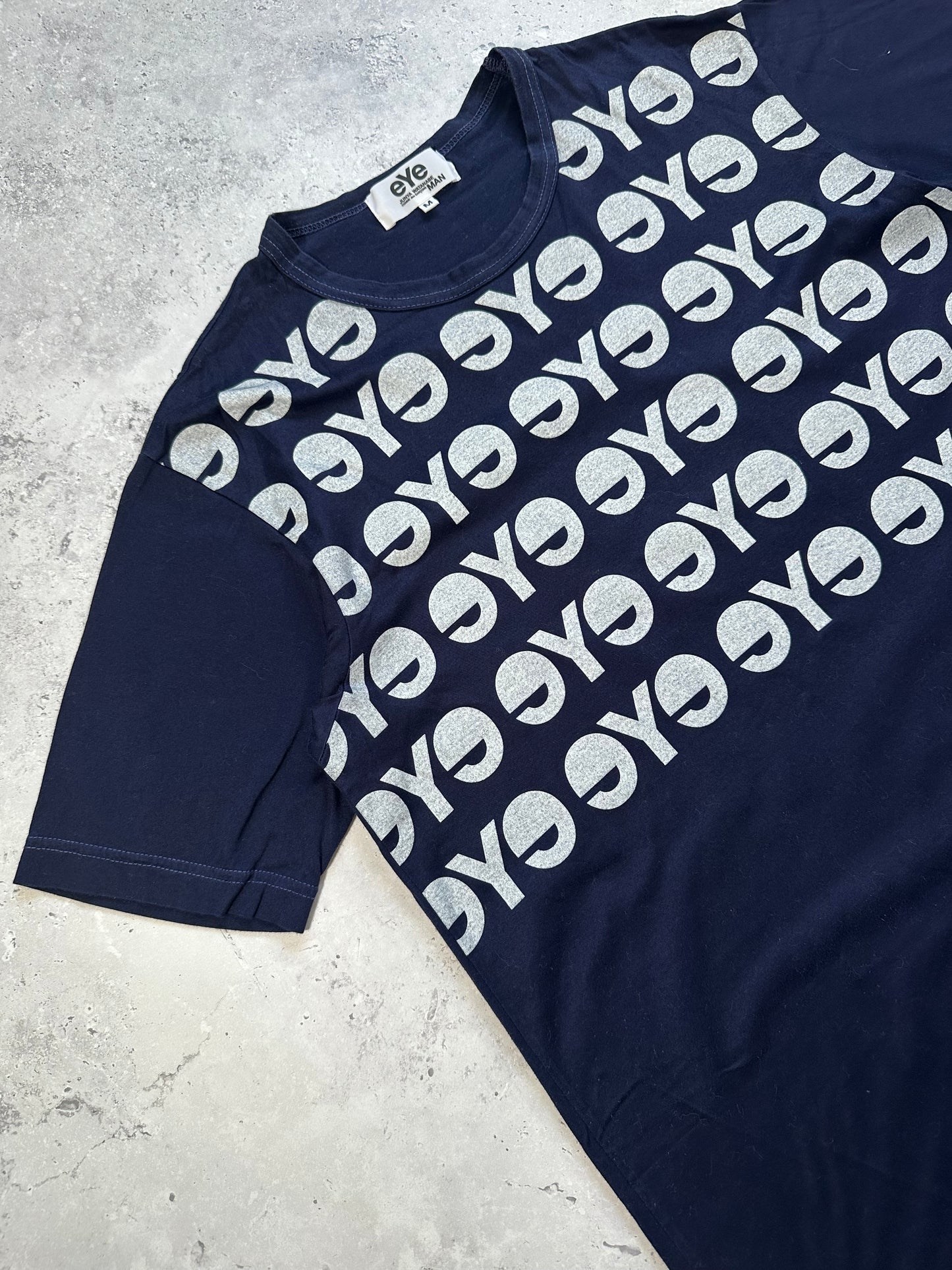 eYe Junya Watanabe MAN COMME des GARÇONS AD2012 All-Over Logo Print T-Shirt