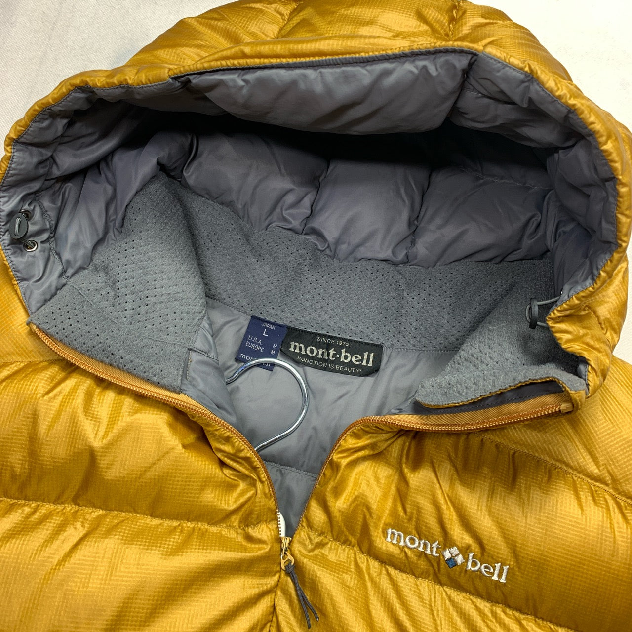 Montbell Hooded Puffer Jacket in Yellow